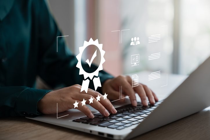 Staff credential compliance tracked on a laptop with a verified checkmark seal